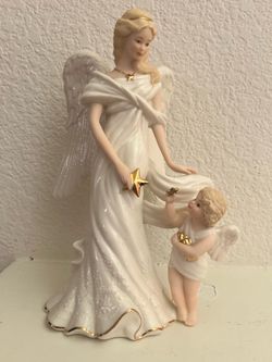 Lenox Angel with gold trim and stars   No. 975 out of 2500.