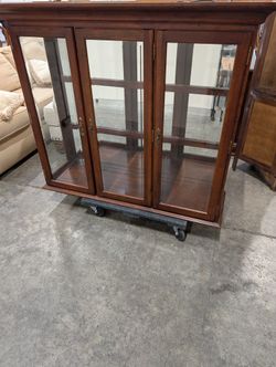 Richly Stained Wooden Display Cabinet with Glass Doors