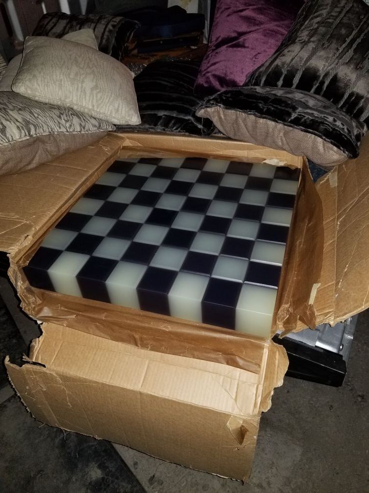 Giant thick plexiglass chess board.