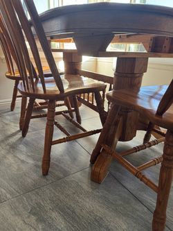 Solid oak dining table and 4 chairs