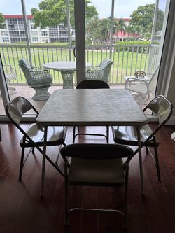 Set of folding card table and chairs