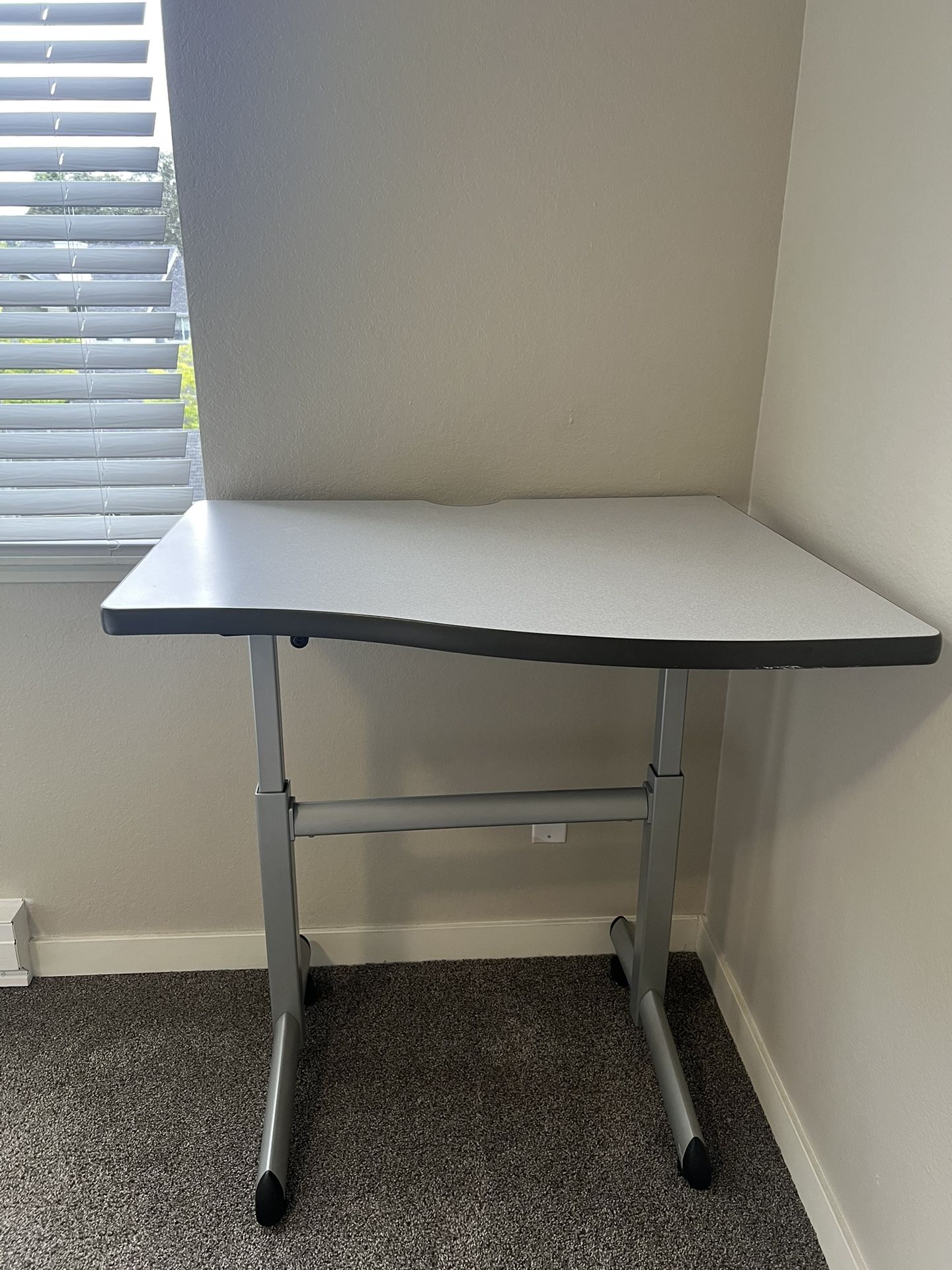 Adjustable sit‑stand desk