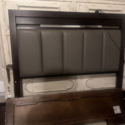 Queen sized wooden bed frame w/ light. 