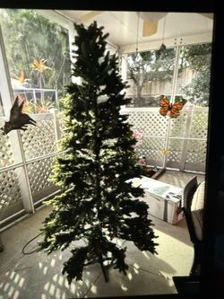 Evergreen Classics 7.5-ft Holiday Symphony Pre-lit Artificial Christmas Tree with LED Lights Plays 7 Songs 