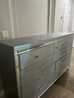 Dresser with matching mirror that lights up.