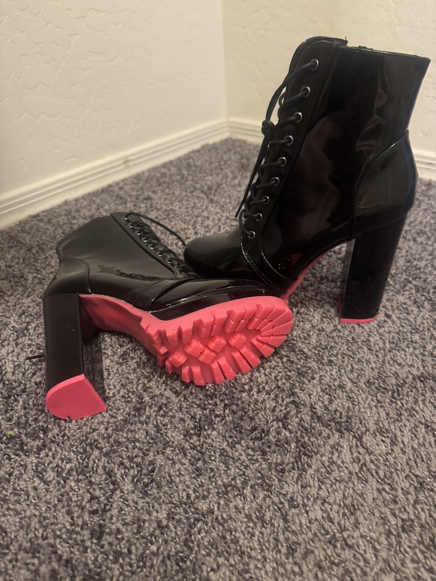 Black boots with pink underneath