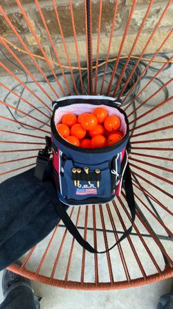 Orange golf balls plus bag