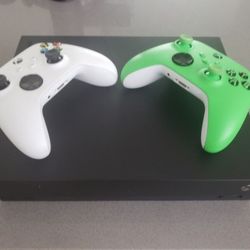 Xbox One X with 5 Games, 2 Controllers, And Carrying Case