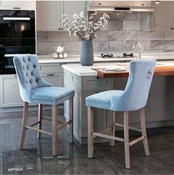Set of 2 Light blue velvet upholstered bar stools with button tufted, wooden legs chrome nailhead trim leisure style bar chairs
