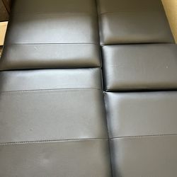 Black leather loveseat in good condition