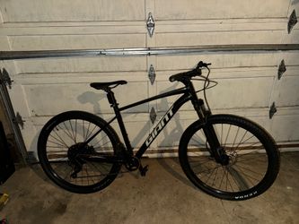 Giant Talon bike black with matching helmet