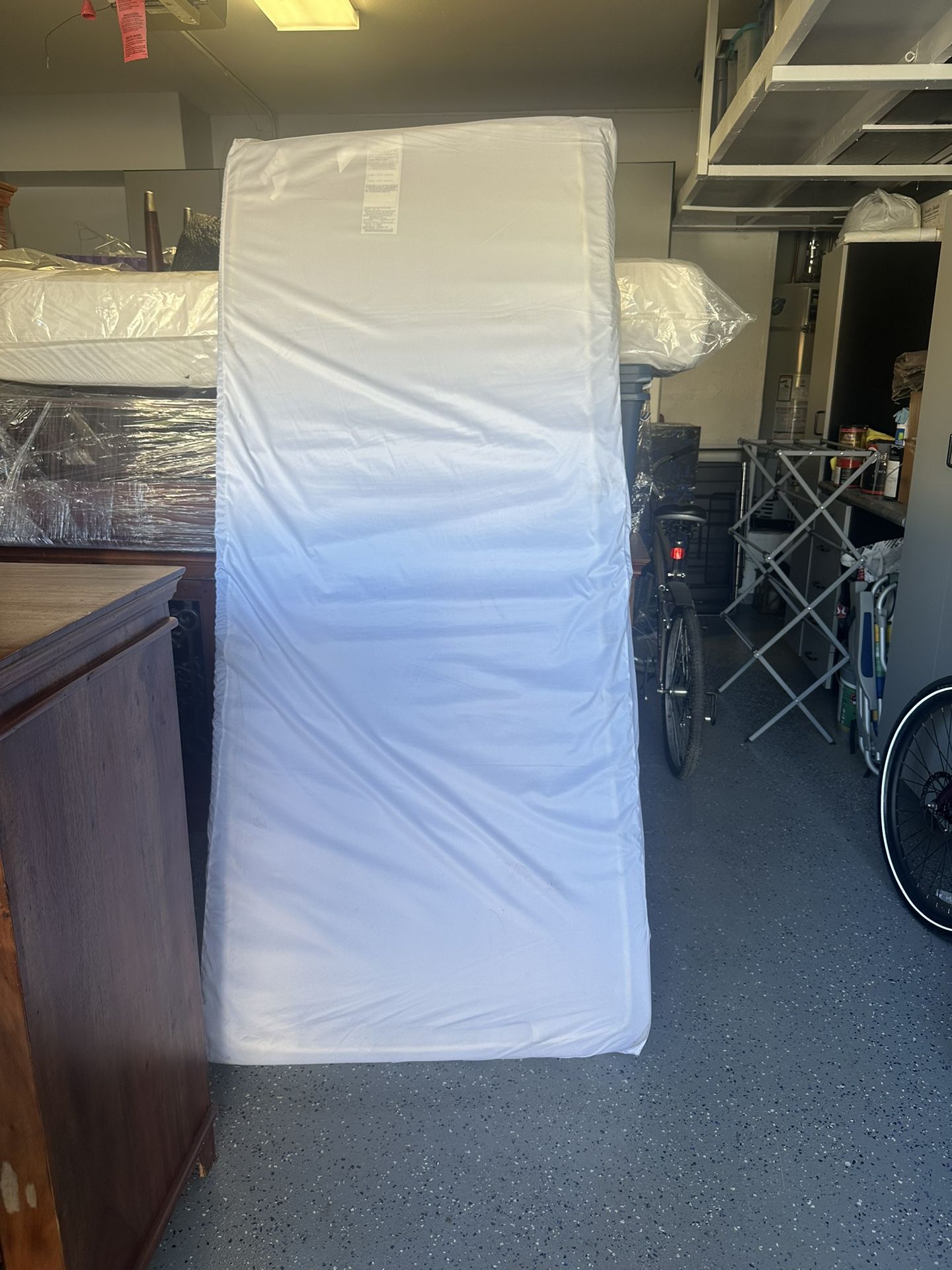 2 twin orthopedic mattresses with cover protectors.