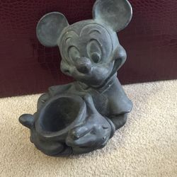 Mickey Mouse.. It is a collection.. You can use it for a flower plant or etc.