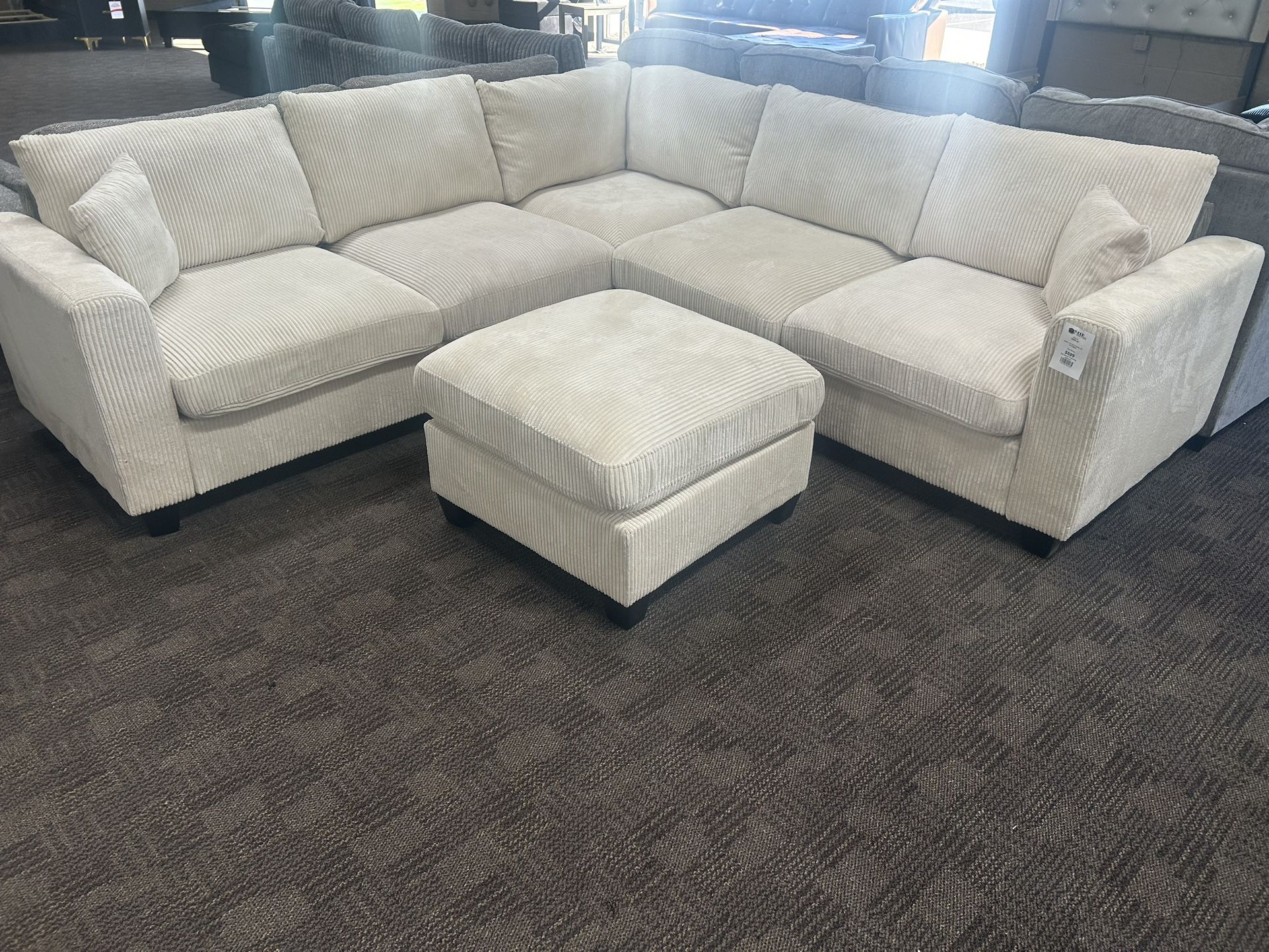 Cream L Shaped Sectional And Ottoman