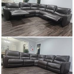 Leather Power Reclining Sectional Couch With Power Headrests.