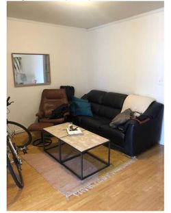 Black leather couch and leather chair