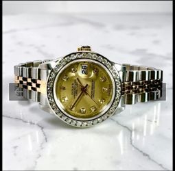 Rolex woman watch gold and diamond