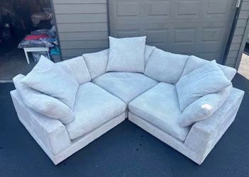 Couch: Cream corduroy sectional with chaise