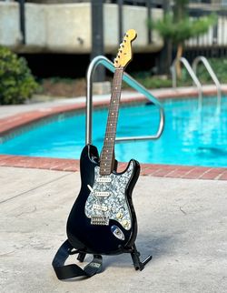 1996 Fender Stratocaster (Mexico) strap, case, stand