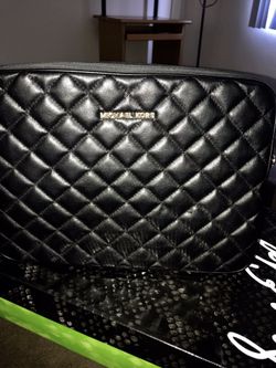 Michael Kors large makeup bag or can be used as a purse if you put the straps on