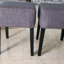2 New Matching Ottomans/Stools. 14" x 14" x 19" tall.  Very sturdy with thick / comfortable cushions.

Durable gray fabric. 
