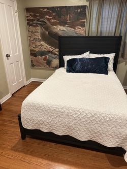 Full size dark wood bed