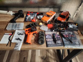 2 axial scx24 toyota 4 runner heavily upgraded brushless and a k10 c10 chevy silverado stock with a bunch of extras