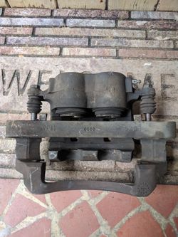 Ford super duty f250 drivers side front caliper & mounting bracket