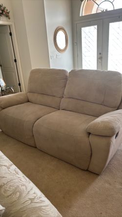Two suede loveseat, one electric one manual Has four recliners need cleaning