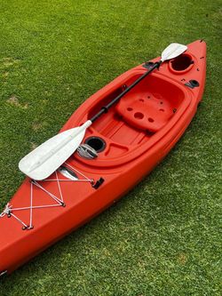 Kayak with paddle,  and Surfboard