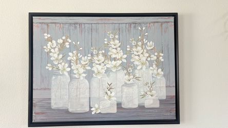 Farmhouse mason jar canvas with white flowers in Ball jars on rustic gray wood background. Black floating frame.  Great condition - no rips or damage.