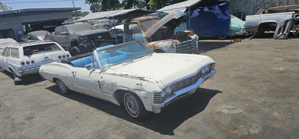 1967 Chevy Impala https://offerup.com/redirect/?o=Q29udmVydGlibGUuVFJBREU=  2016 NEWER  Chevy Suburban YUKON