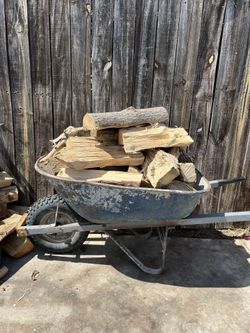 A Wheelbarrow Of Firewood For $20. Wheelbarrow Not Included