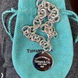 Tiffany & Co.Return to Tiffany Silver Circle Tag Charm with pouch, box & bag