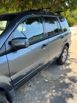 2005 Honda pit 313 mil millas 7 pasajeros 6 silindro placas al dia y en buenas condiciones