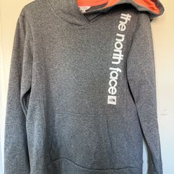The North Face Women's Graphic Pullover Hoodie in gray with a coral-orange interior