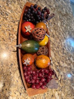 Wooden boat bowl with artificial fruit decor