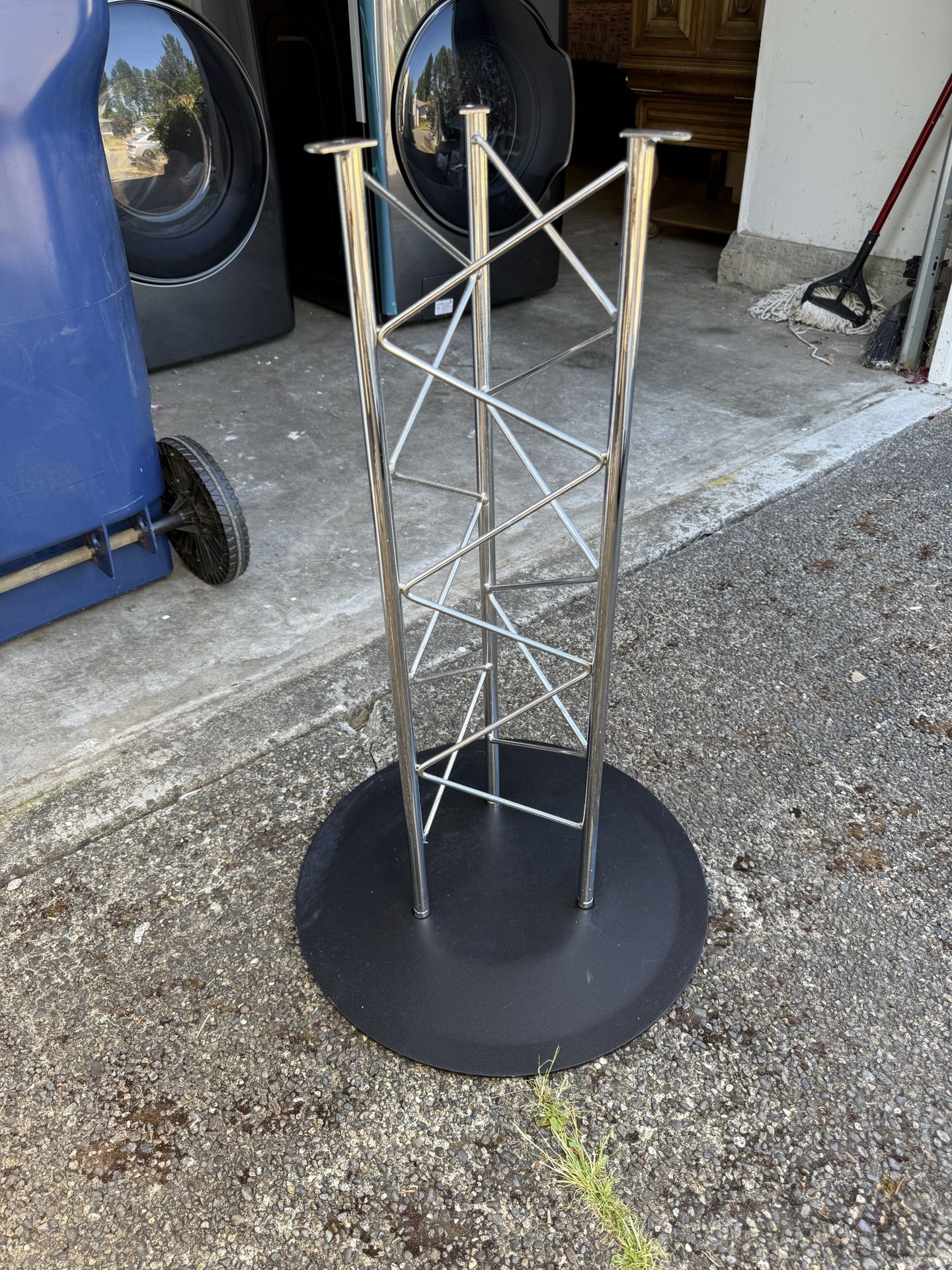 Round glass top dining table with modern truss base