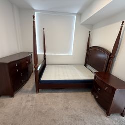 Queen-size canopy bed set, dresser, and nightstand.