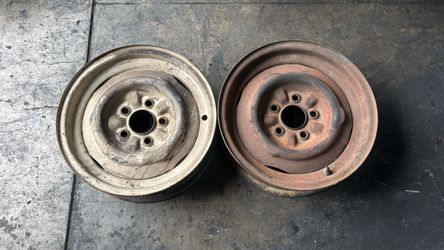 Two 15x5 inch Cateye FoMoCo Steelies 5x4.5 Lugs Ford, Lincoln, Mercury