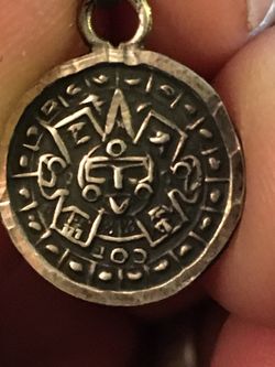 Three sterling silver Mayan pendants
