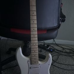 Electric guitar comes with mini amp