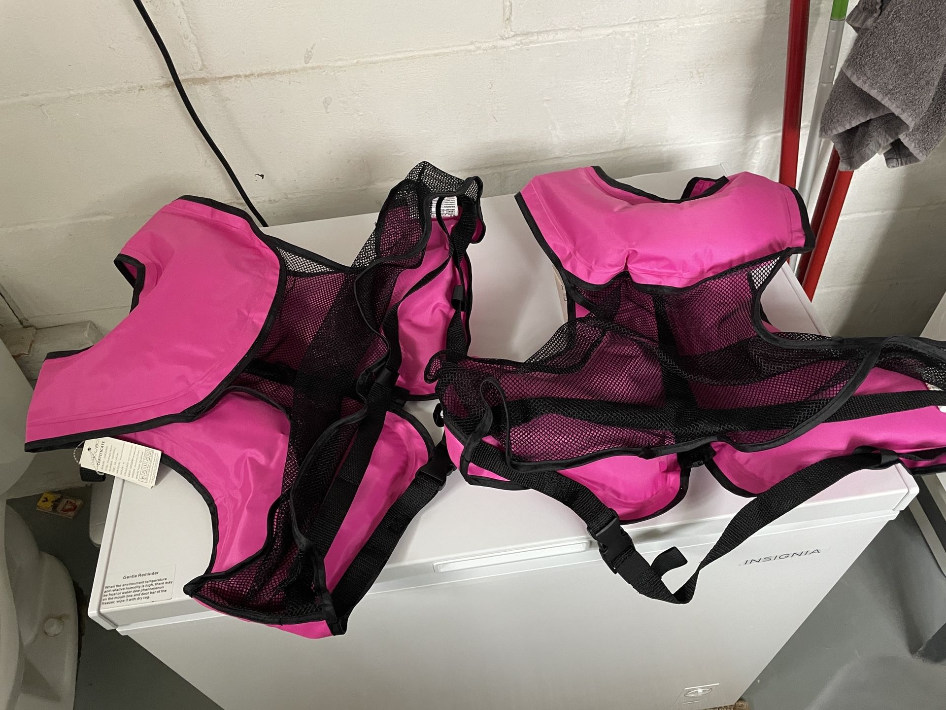 Life Jackets-new with tags-unused.Adjustable to fit adults or kids.