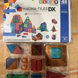 This is a Magna-Tiles DX Clear Colors 48-Piece Deluxe Set. 
