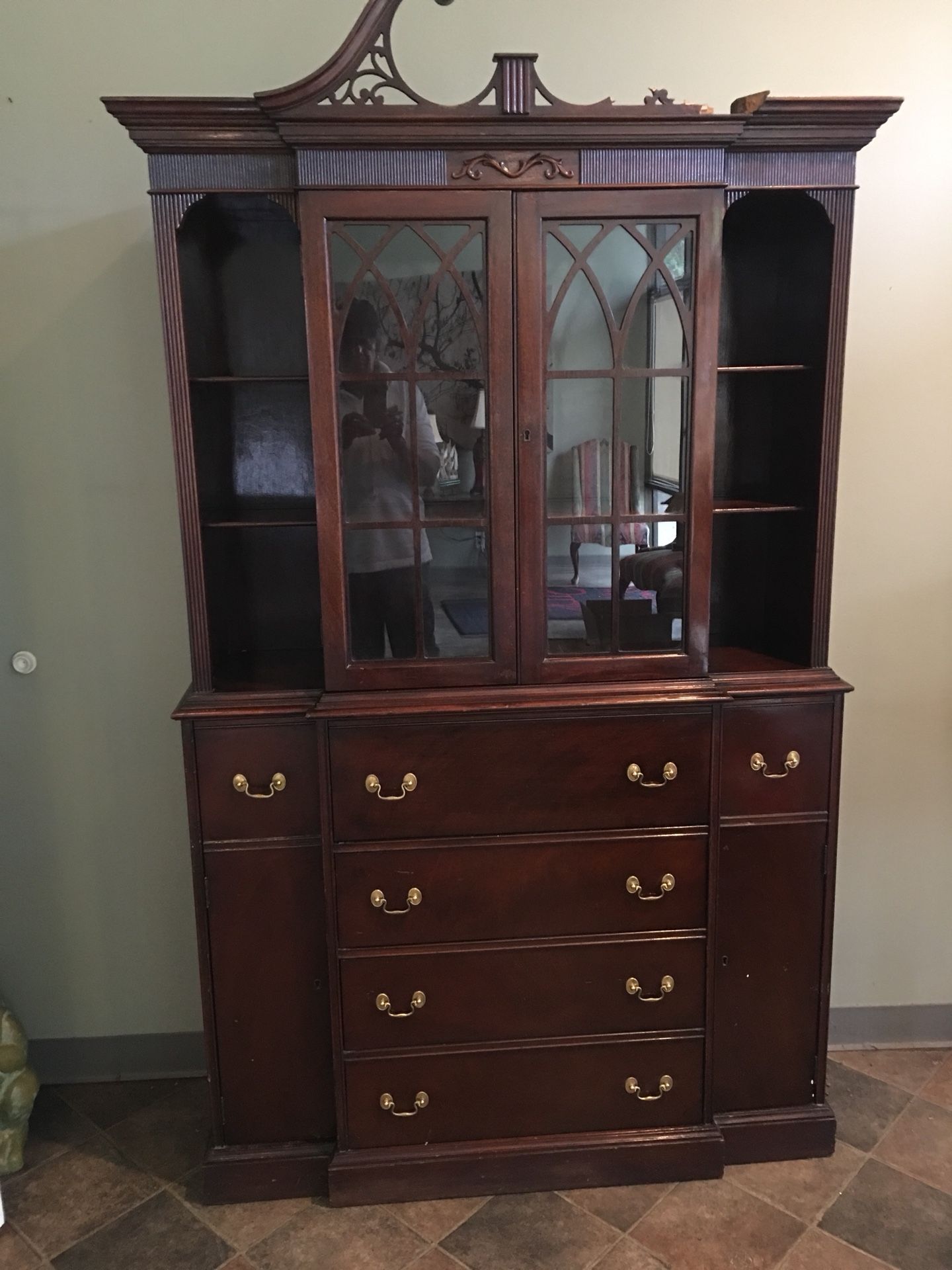 Beautiful Maddox mahogany cabinet with pullout secretary. Open display shelves on each side of glassed in middle.
