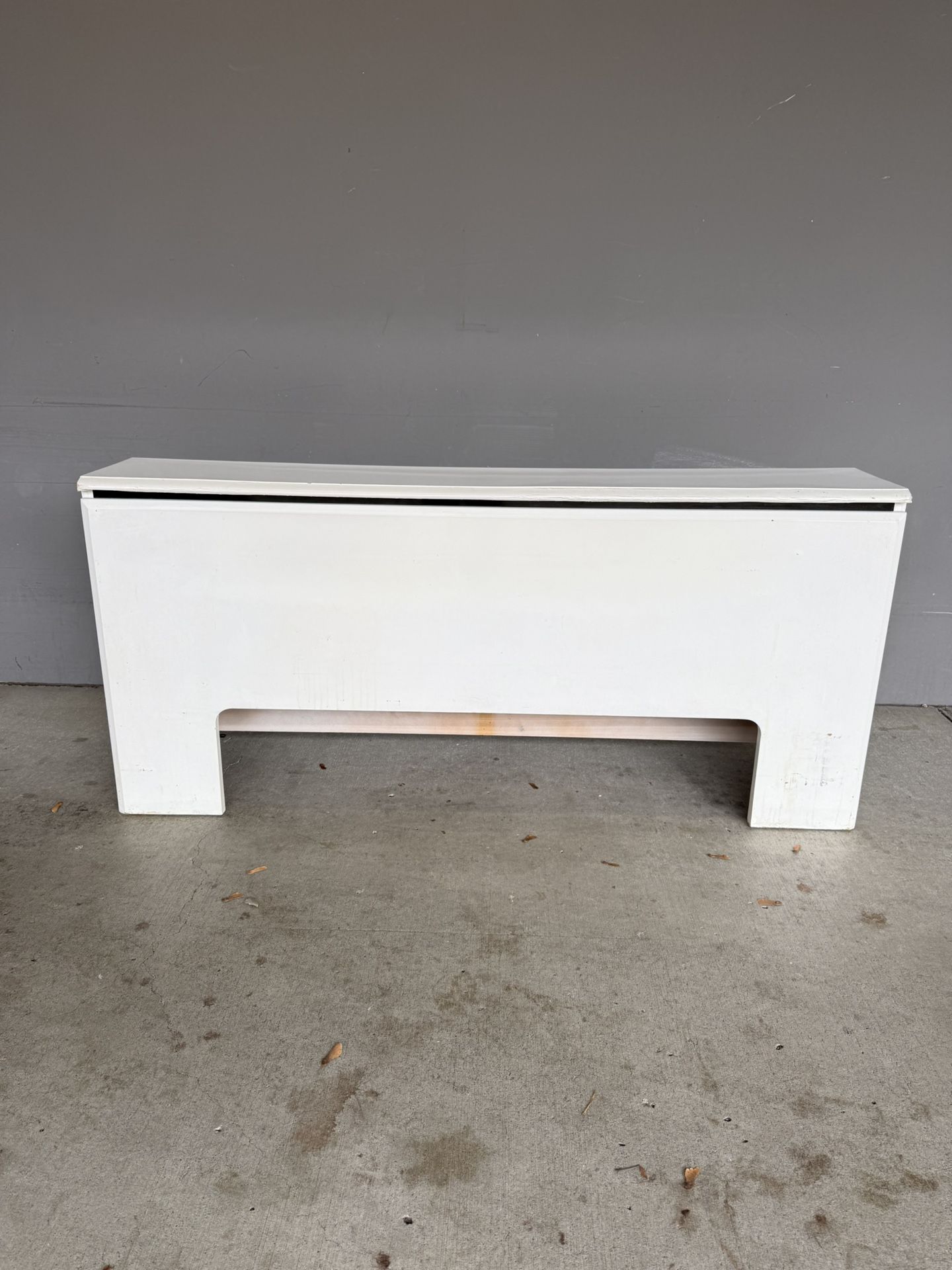 A long white table. White table for the living room