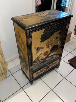 Asian Lacquered Gold Cabinet with Hand-Painted Crane Scene