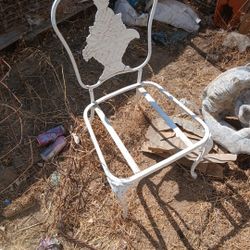 Two antique metal chairs