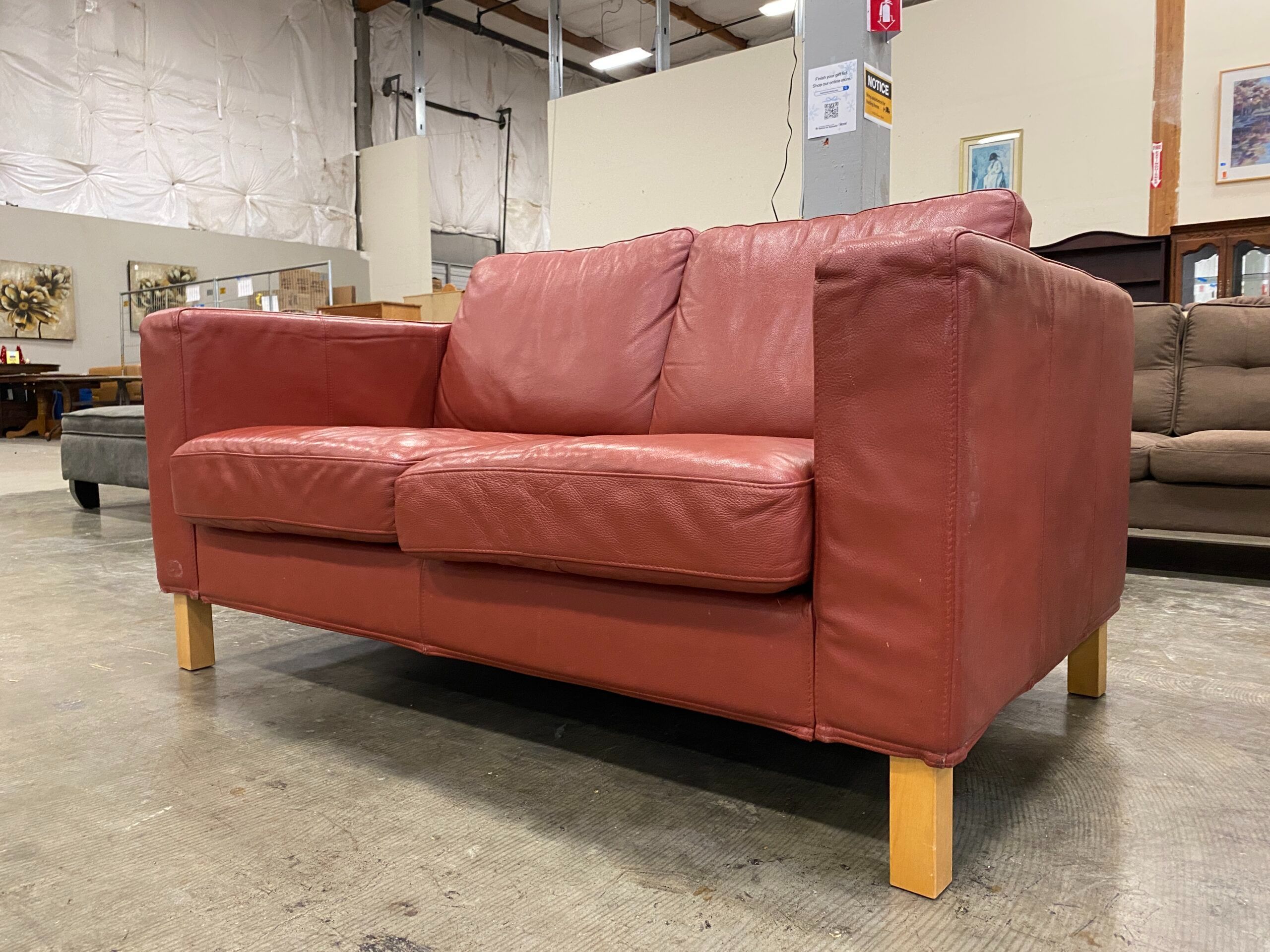 Boxy Maroon Loveseat with Light Wood Legs