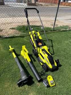 RYOBI 3-piece kit: 13-inch cordless electric grass trimmer, cordless blower, (1) 1.5 Ah battery, (1) charger.